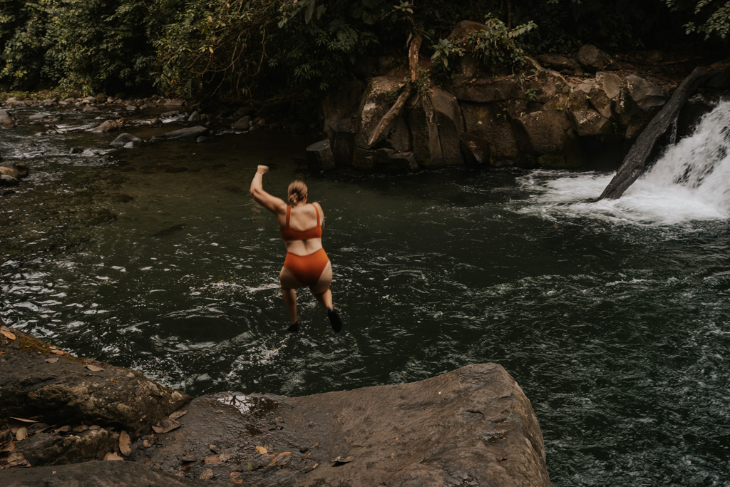 A woman jumping from the cliff at El Salto Costa Rica