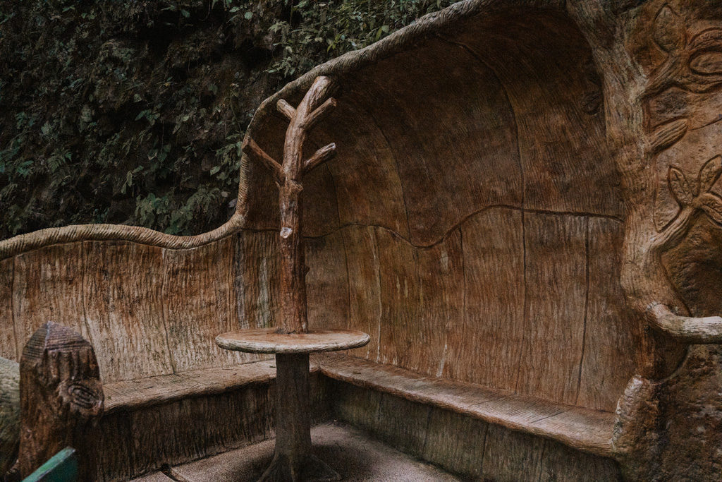 wooden carved seating area in the jungle