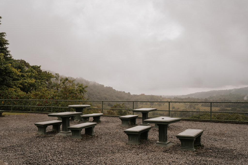 picnic tables at the hanging bridges costa rica arenal park on a misty day