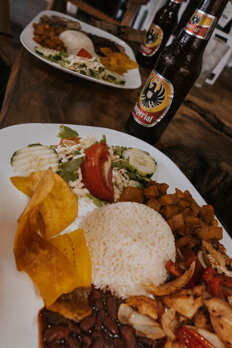 traditional casado dish with rice and a variety of sides at a restaurant near celeste waterfall costa rica