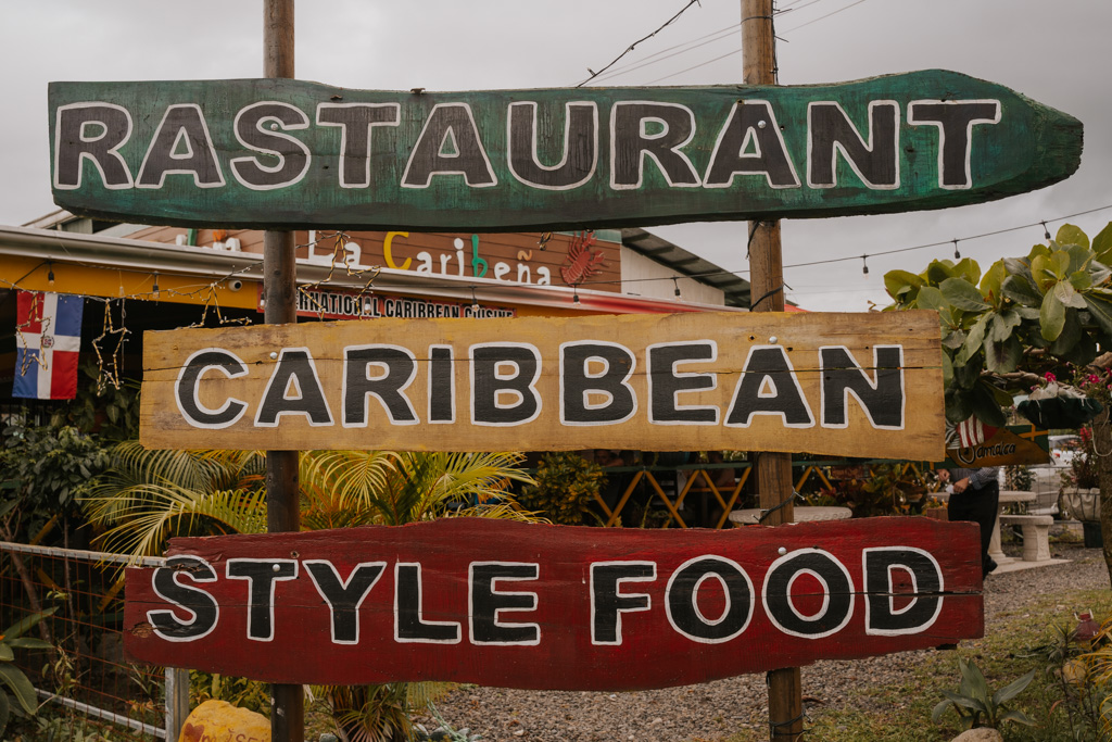green, yellow and red sign reading 'rastaurant caribbean style food'